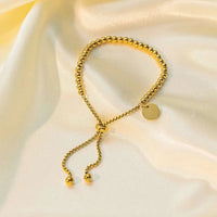 Stainless steel beaded ball chain bracelet with round coin charm and adjustable slider closure