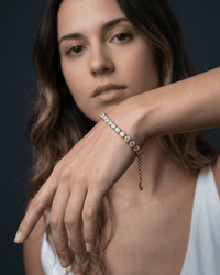 Gold dainty zirconia tennis chain bracelet on wrist