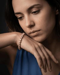 Gold dainty zirconia tennis chain bracelet on wrist