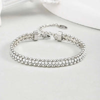 Duet Glow double row gold tennis bracelet with olive bead setting and white zirconia stones