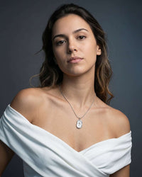 Embossed tulip coin pendant necklace in gold and silver stainless steel