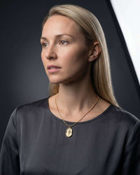 Embossed tulip coin pendant necklace with flat snake chain in gold and silver