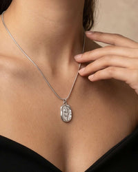 Stainless steel embossed tulip coin pendant necklace with flat snake chain in gold and silver