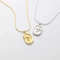 stainless steel embossed tulip coin pendant necklace on flat snake chain