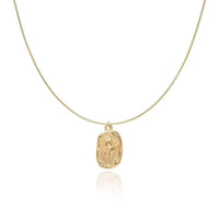 Embossed tulip coin pendant necklace in gold on flat snake chain