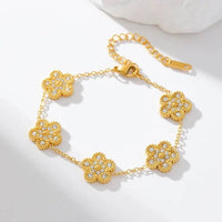 Gold flower clover bracelet with micro pave zircon stones