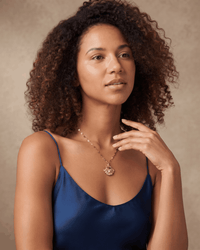 Gold shell pendant necklace with delicate chain