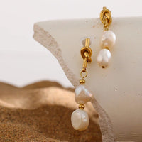 Knotted 14k gold drop earrings with natural pearl