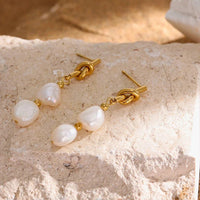 Knotted 14k gold pearl drop earrings with geometric design