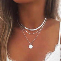 Gold layered coin disc pendant on flat snake chain necklace, minimalist jewelry design