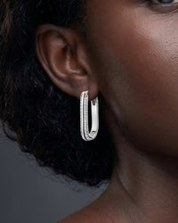 Silver plated lustre oval huggie earrings with double row cubic zirconia