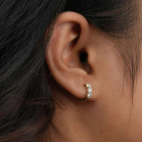 925 sterling silver moissanite hoop earrings with 0.9cttw round D/VVS1 stones in classic design