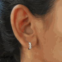 925 sterling silver moissanite hoop earrings with 0.9cttw round D/VVS1 stones in classic design