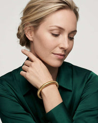 Multi-strand stacked bangle set with gold and silver tones
