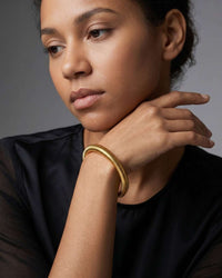 Multi-strand stacked bangle set with gold and silver tones