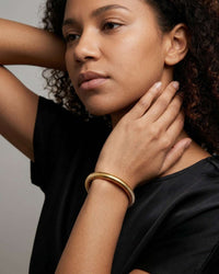 Multi-strand stacked bangle set with gold and silver tones
