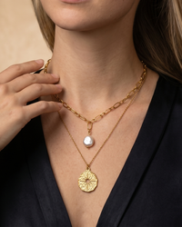 Gold layered necklace with North Star coin pendant on paperclip chains