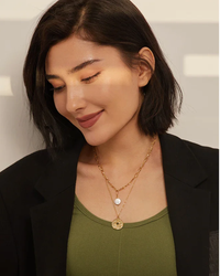 Gold stainless steel North Star coin pendant layered on chunky paperclip chain necklace