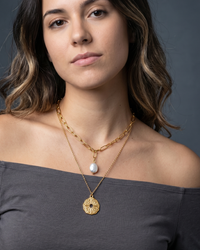 Gold layered necklace with North Star coin pendant on chunky paperclip chains