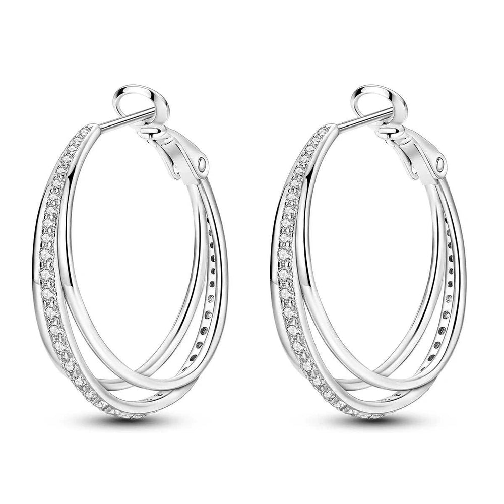 Silver plated orbit crossover hoop earrings with cubic zirconia pavé