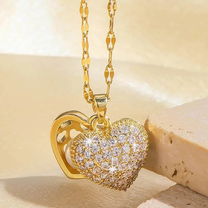 Gold pearl heart pendant necklace with open heart design
