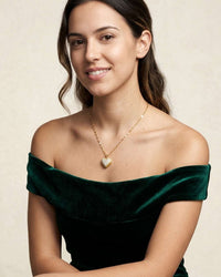 Gold open heart pendant necklace with central pearl