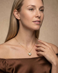 Gold open heart pendant necklace with central pearl