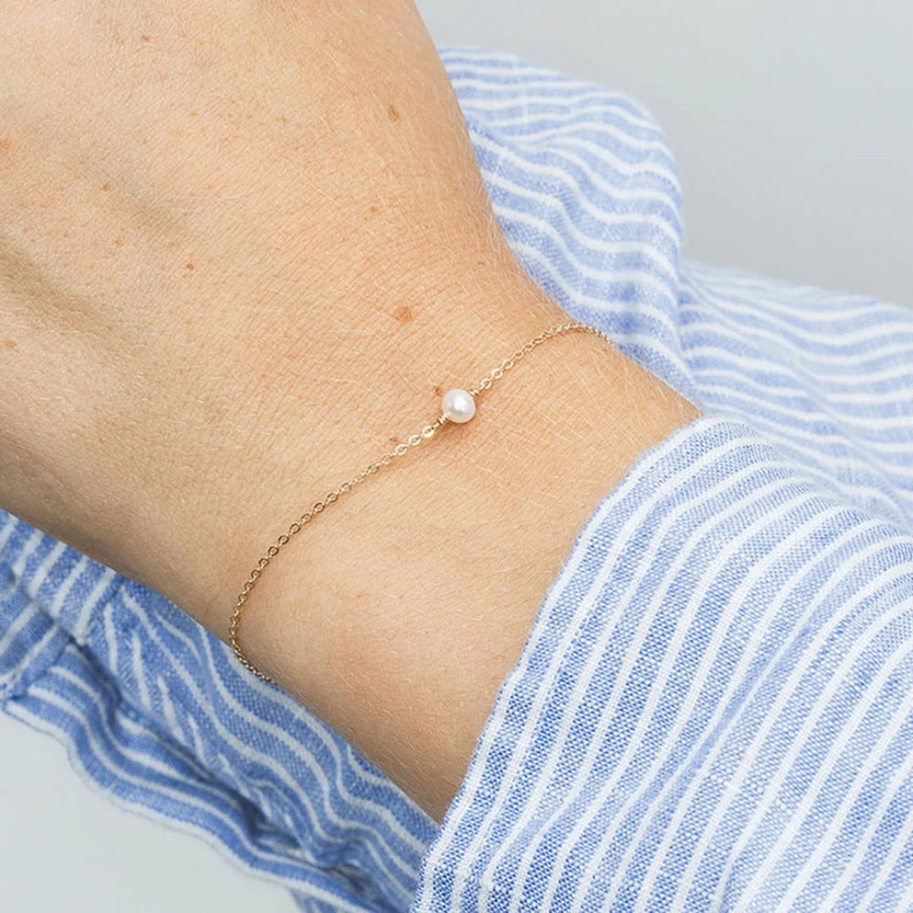 14k gold plated single pearl charm bracelet on slim chain