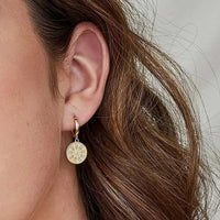Sovereign coin huggie earrings with textured medallion in stainless steel