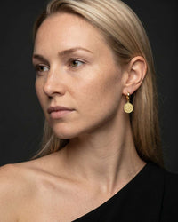 Sovereign coin huggie earrings with textured coin medallion and hinged snap closure