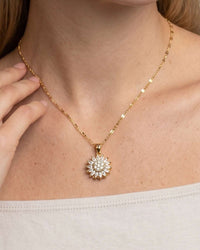 Spinning sunflower pendant necklace with zircon crystals in gold finish