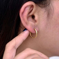 Twisted texture stainless steel huggie hoop earrings in gold and silver